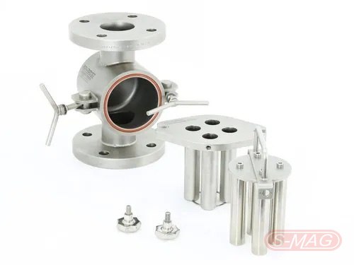 In-line magnetic liquid trap dismantled, showing the flanged body and rod clusters